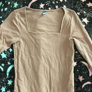 Tan body suit with long sleeves